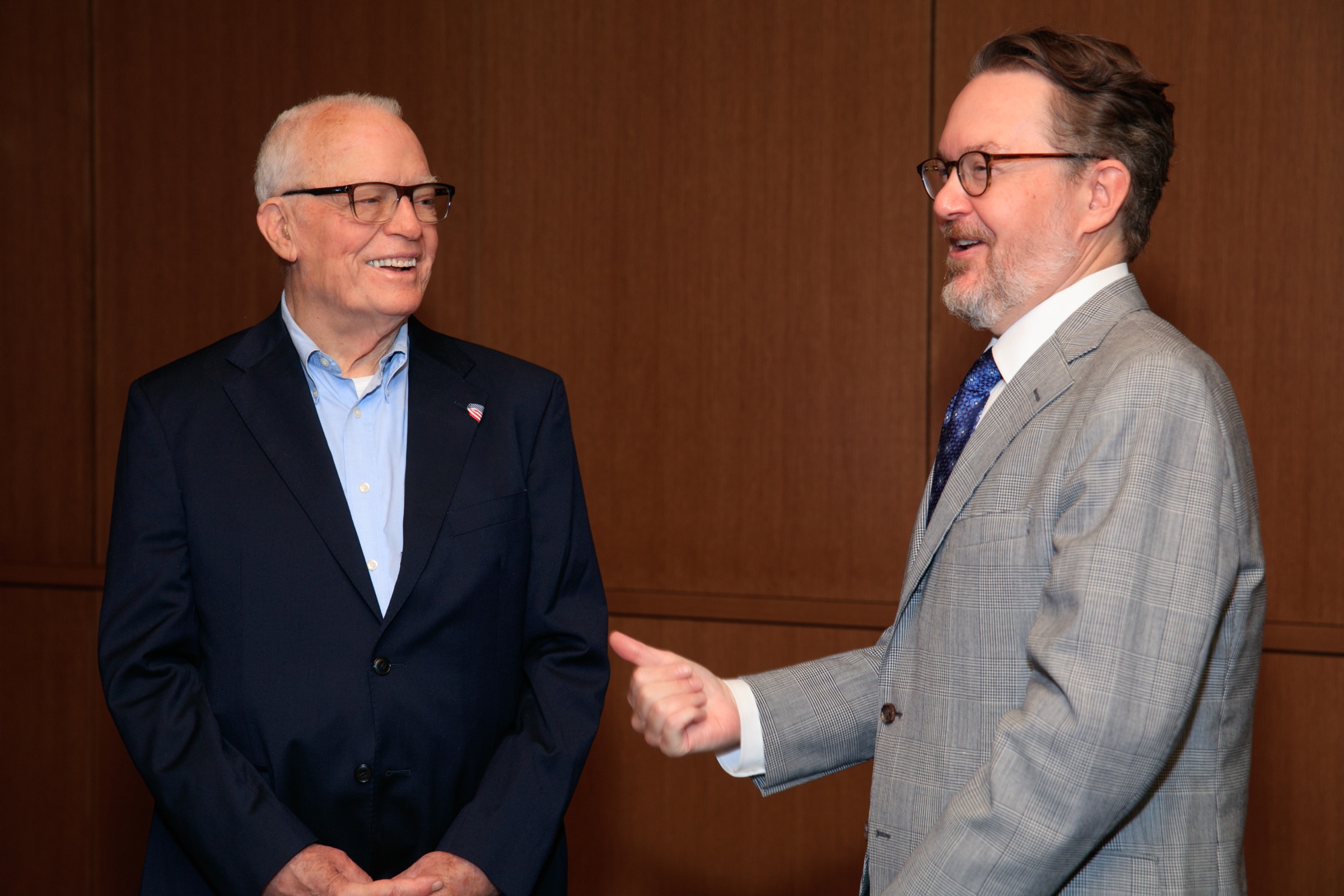 Andrew Reeves laughing during a conversation at the launch of the Frick Initiatives
